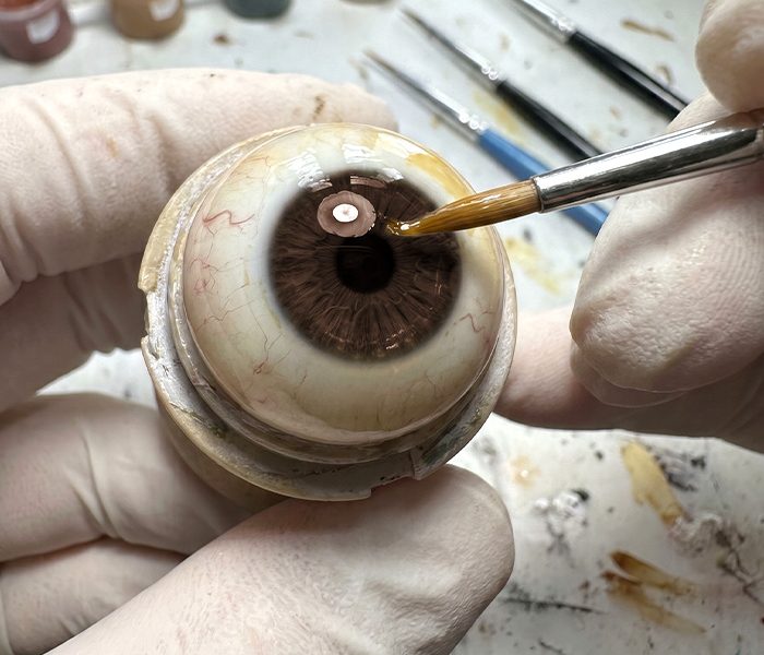 Layered coloring technique for a natural-looking ocular prosthesis